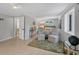 Serene bedroom with neutral decor, sitting area, and views, perfect for relaxing and unwinding at 7320 Melaleuca Way, Siesta Key, FL 34242