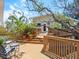 Large deck with seating area and beautiful landscaping at 7320 Melaleuca Way, Siesta Key, FL 34242