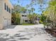 Charming home with meticulous landscaping, impact windows, and large driveway at 7320 Melaleuca Way, Siesta Key, FL 34242