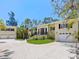 Charming home with meticulous landscaping, impact windows, and large driveway at 7320 Melaleuca Way, Siesta Key, FL 34242