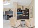 Cozy living room with a bar area, built-in shelves and comfortable seating at 7320 Melaleuca Way, Siesta Key, FL 34242