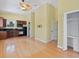 Open living area with hardwood floors, kitchen, and a dining table at 7320 Melaleuca Way, Siesta Key, FL 34242