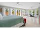Spacious main bedroom with private deck access and exercise equipment at 7320 Melaleuca Way, Siesta Key, FL 34242