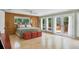 Light-filled bedroom featuring built-in storage and private patio at 7320 Melaleuca Way, Siesta Key, FL 34242
