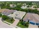 Aerial view of a beautiful home showcasing its prime location, landscaping, and surrounding neighborhood at 7717 Sandhill Lake Dr, Sarasota, FL 34241