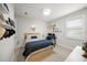 Bedroom with shelves decorated with toys, large windows and neutral color palette at 7717 Sandhill Lake Dr, Sarasota, FL 34241