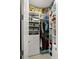 Organized walk-in closet features shelves, drawers, and clothing racks filled with clothes and accessories at 7717 Sandhill Lake Dr, Sarasota, FL 34241