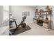 Bright exercise room with exercise bike, decorative wall art, and work desk at 7717 Sandhill Lake Dr, Sarasota, FL 34241