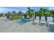 Small hot tub with several lounge chairs surrounding the perimeter on a brick surface with vegetation at 7717 Sandhill Lake Dr, Sarasota, FL 34241