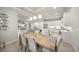 Open concept dining and kitchen area with island, recessed lights, and stainless appliances at 7717 Sandhill Lake Dr, Sarasota, FL 34241