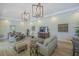 Bright and airy living room with modern decor, stylish lighting, and comfortable seating at 7717 Sandhill Lake Dr, Sarasota, FL 34241