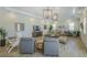 Spacious living room with contemporary furniture, a dining area, and a cozy atmosphere at 7717 Sandhill Lake Dr, Sarasota, FL 34241