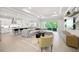 Spacious open concept living and kitchen area with light tile floors and modern finishes at 7717 Sandhill Lake Dr, Sarasota, FL 34241
