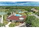 Aerial view of the community center with a pool, playground, and sports areas, perfect for recreation at 7885 Bristol Park Dr, Apollo Beach, FL 33572