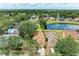 Aerial view showcasing residences, a pond with water lilies, and green landscaping in a vibrant community at 7885 Bristol Park Dr, Apollo Beach, FL 33572