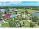 Aerial view of community amenities, pools, parks, tennis courts, and surrounding landscape at 7885 Bristol Park Dr, Apollo Beach, FL 33572
