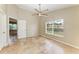 Bedroom with tile floors, a ceiling fan, neutral paint and a large window at 7885 Bristol Park Dr, Apollo Beach, FL 33572