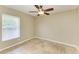 Well-lit bedroom with tiled floors, neutral paint and large windows at 7885 Bristol Park Dr, Apollo Beach, FL 33572