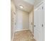 Bright foyer with neutral walls, tiled floor, and access to other rooms at 7885 Bristol Park Dr, Apollo Beach, FL 33572