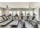 Fitness center featuring modern treadmills, elliptical machines, and ample natural light at 7885 Bristol Park Dr, Apollo Beach, FL 33572