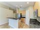 Well-equipped kitchen with stainless steel appliances and granite countertops at 7885 Bristol Park Dr, Apollo Beach, FL 33572