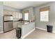 A cozy kitchen area featuring stainless steel appliances and granite countertops at 7885 Bristol Park Dr, Apollo Beach, FL 33572