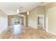 Bright living room with tile flooring, sliding glass doors, and modern pendant lighting at 7885 Bristol Park Dr, Apollo Beach, FL 33572