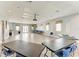 Spacious meeting room with tables, chairs, and a projector for presentations at 7885 Bristol Park Dr, Apollo Beach, FL 33572
