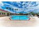 Inviting community pool with clear blue water, umbrellas, and nearby amenities at 7885 Bristol Park Dr, Apollo Beach, FL 33572