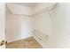 Walk-in closet featuring metal shelving for optimal storage space at 7885 Bristol Park Dr, Apollo Beach, FL 33572
