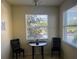 Cozy breakfast nook with table and chairs near a bright window at 7911 Grand Estuary Trl # 201, Bradenton, FL 34212
