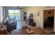 Comfortable living room and dining area leading to a screened lanai at 7911 Grand Estuary Trl # 201, Bradenton, FL 34212