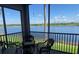 Relaxing screened patio featuring beautiful lake views and comfortable seating at 7911 Grand Estuary Trl # 201, Bradenton, FL 34212