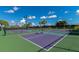 Bright and colorful pickleball courts with lush green surroundings offer a fun recreational space at 7911 Grand Estuary Trl # 201, Bradenton, FL 34212