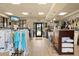 Bright pro shop with apparel racks, equipment displays, and a service counter for tennis enthusiasts at 7911 Grand Estuary Trl # 201, Bradenton, FL 34212