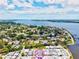 An aerial view of a waterfront community showing a charming home near the water with beautiful river views at 8 Desoto E St, Bradenton, FL 34208