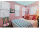 Inviting bedroom featuring a cozy bed with bright pillows, complemented by a unique decor at 8 Desoto E St, Bradenton, FL 34208