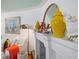 A decorative fireplace mantel with stylish art and accent pieces at 8 Desoto E St, Bradenton, FL 34208