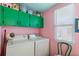 Efficient laundry room featuring updated appliances and ample storage space at 8 Desoto E St, Bradenton, FL 34208