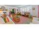 Bright and airy living room with a colorful kitchen in the background and stylish furnishings at 8 Desoto E St, Bradenton, FL 34208