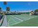 Community shuffleboard courts with covered viewing area, benches and lush greenery at 8 Desoto E St, Bradenton, FL 34208