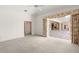 Large bedroom features neutral paint, soft carpet, and sliding doors to the pool at 8 Dominica Dr, Englewood, FL 34223
