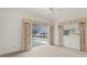 Spacious bedroom features a ceiling fan and sliding glass doors to the pool area at 8 Dominica Dr, Englewood, FL 34223