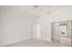 Neutral bedroom featuring mirrored closet doors and an ensuite bathroom at 8 Dominica Dr, Englewood, FL 34223