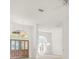 Bright entryway with white walls, decorative light fixtures, and an arched window at 8 Dominica Dr, Englewood, FL 34223