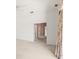Carpeted hallway with floral wallpaper and glass doors to the pool at 8 Dominica Dr, Englewood, FL 34223