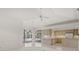 Elegant living area with a fireplace, wet bar, and sliding glass doors to the pool at 8 Dominica Dr, Englewood, FL 34223