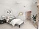 Bright main bedroom with stylish decor, a ceiling fan, and access to a bathroom at 8 Dominica Dr, Englewood, FL 34223