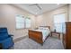 Comfortable bedroom featuring a ceiling fan, natural light, and neutral decor at 924 Indian Beach Dr, Sarasota, FL 34234