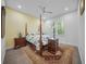 Warm and inviting bedroom with a four-poster bed, soft lighting, and a window with privacy blinds at 924 Indian Beach Dr, Sarasota, FL 34234